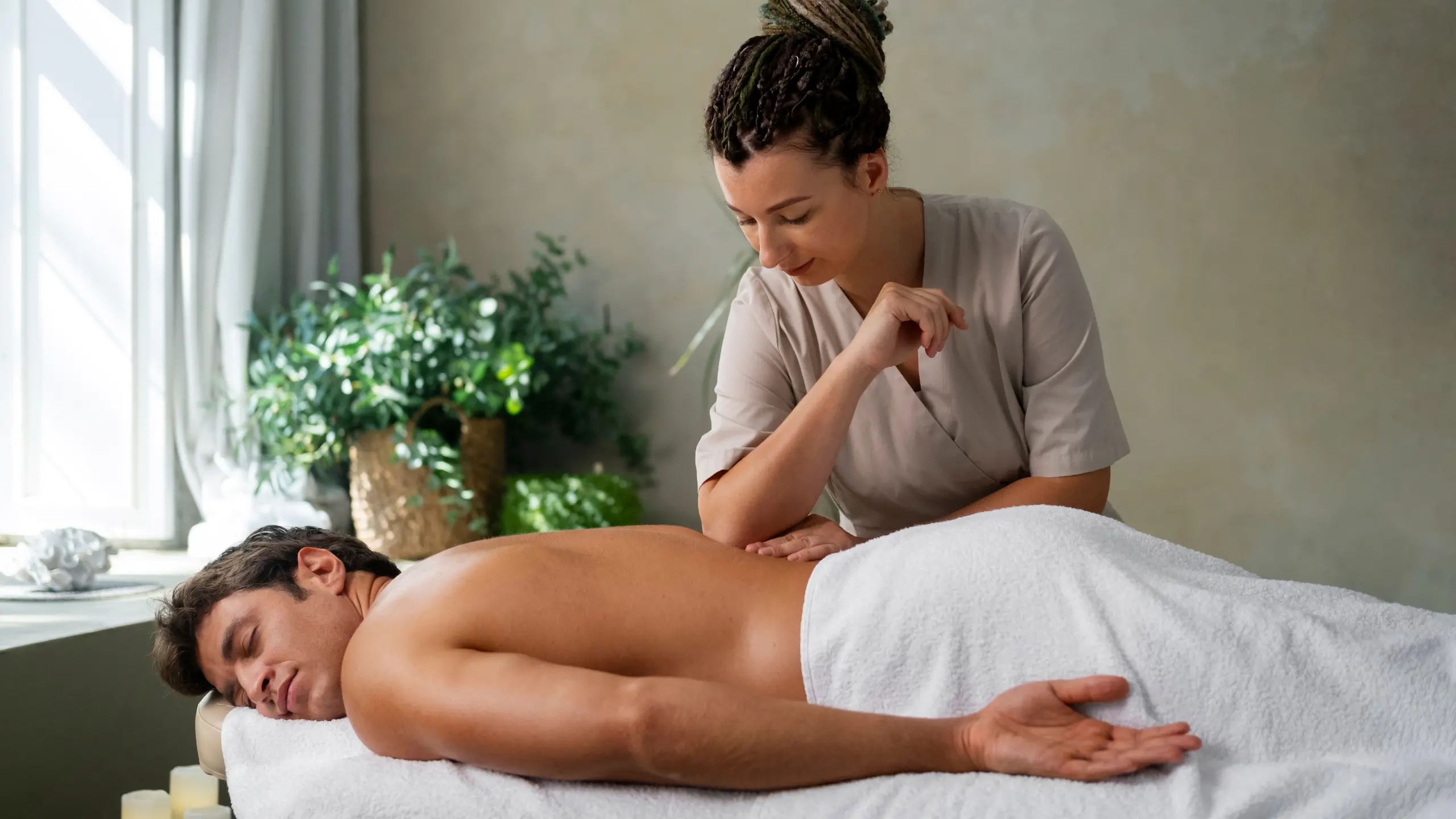 Home relaxed man enjoying in back massage at health spa.